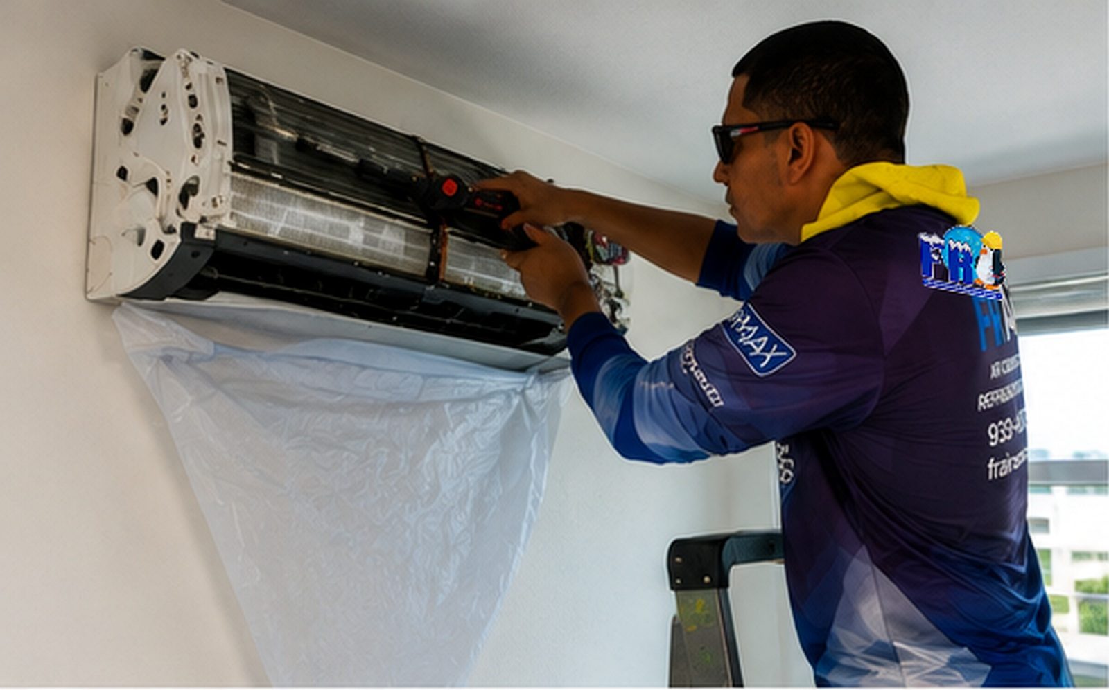 FR Air technician working on a wall-mounted mini-split